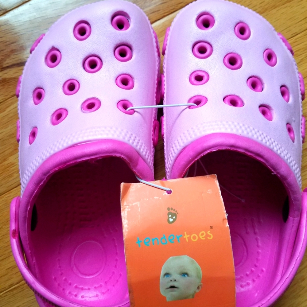 Cute pink little girls' crocs-like slippers. New with tags. Never used. Size 11t